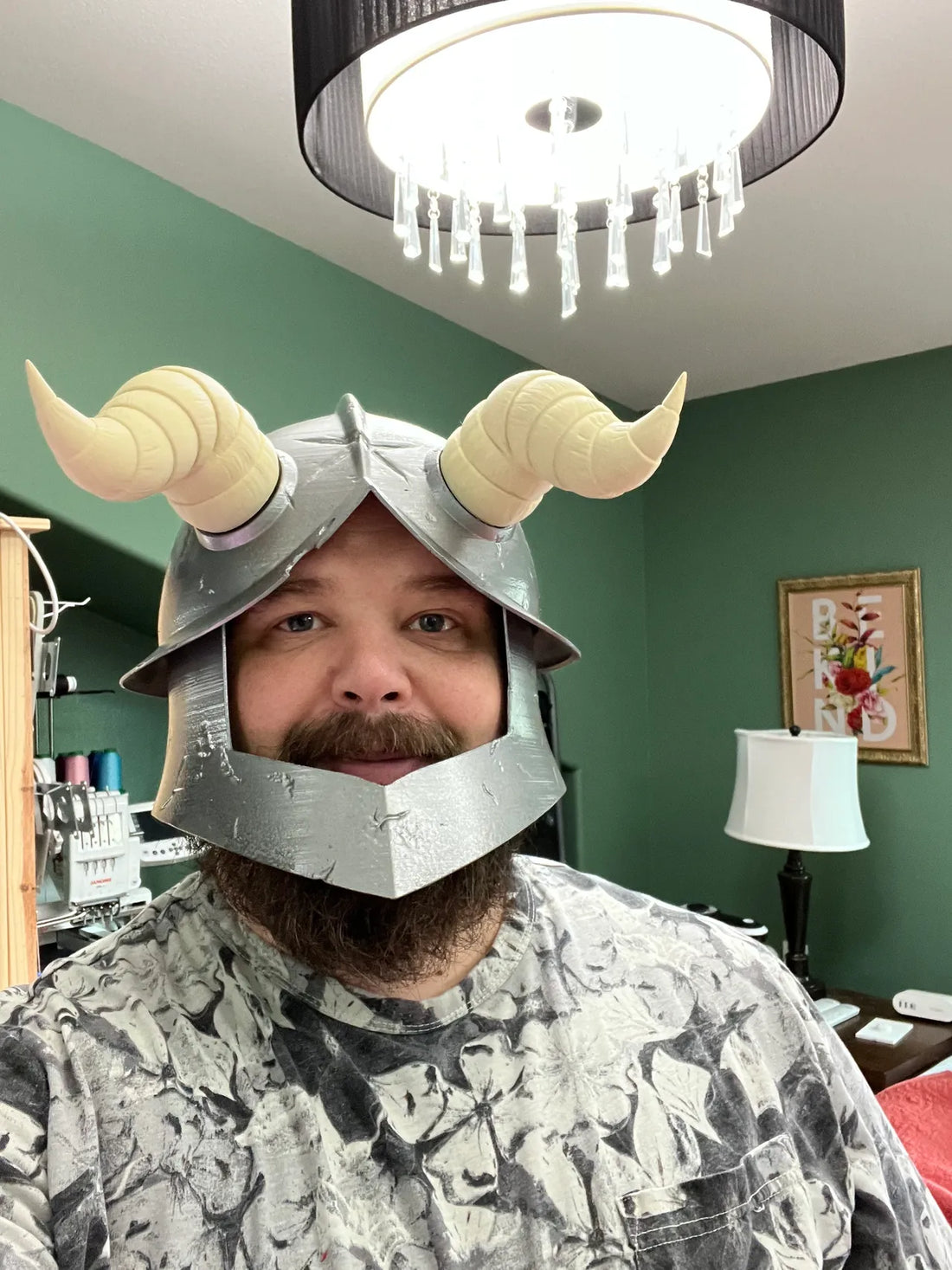 bearded nerd in a cosplay helmet made to look like Senshi's helmet in Dungeon Meshi