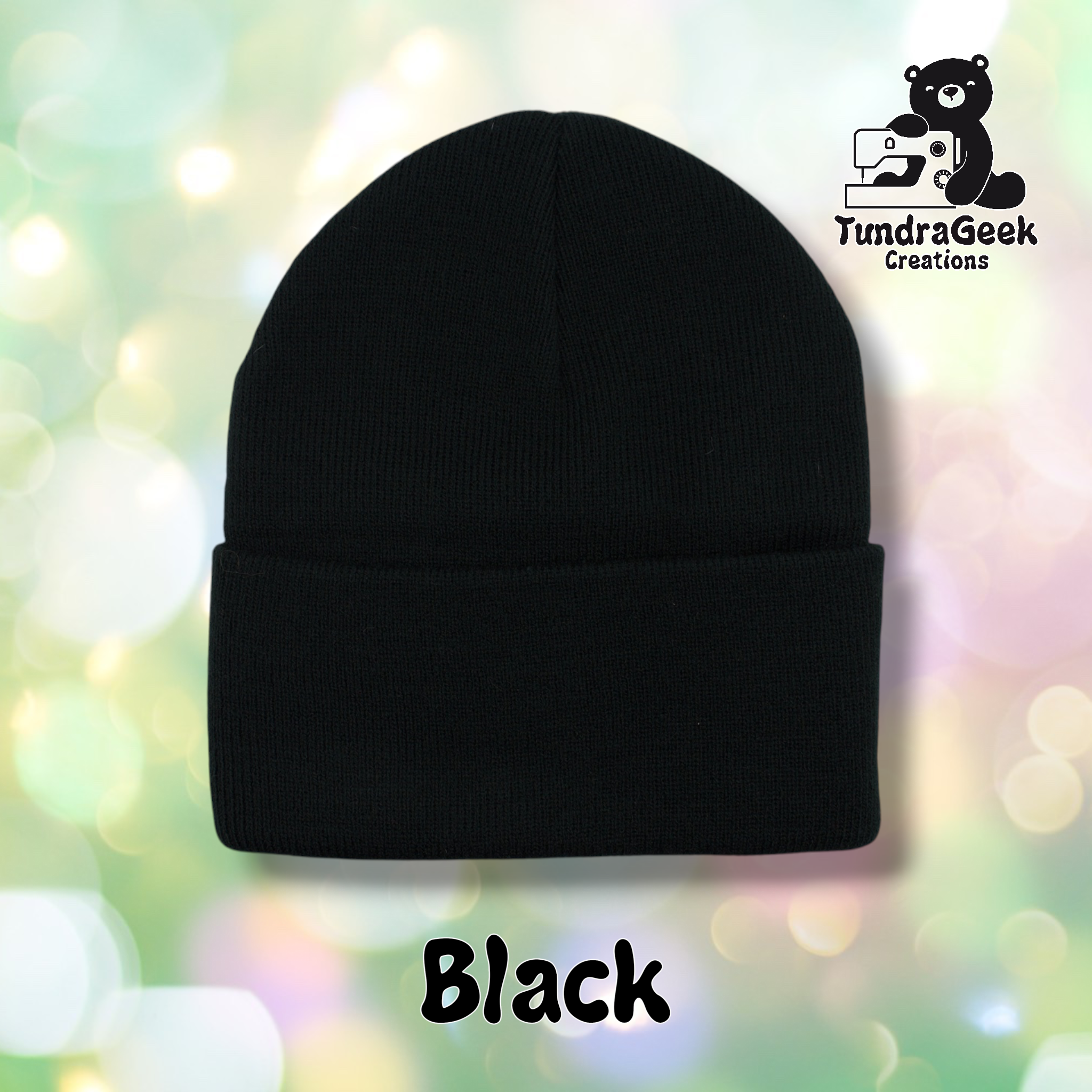 Plain black cuffed beanie on a pastel bokeh background. Text reads "Black" at the bottom of the image.