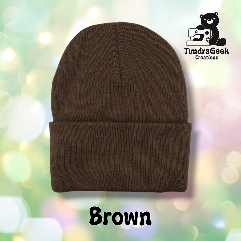 Plain brown cuffed beanie on a pastel bokeh background. Text reads "Brown" at the bottom of the image.