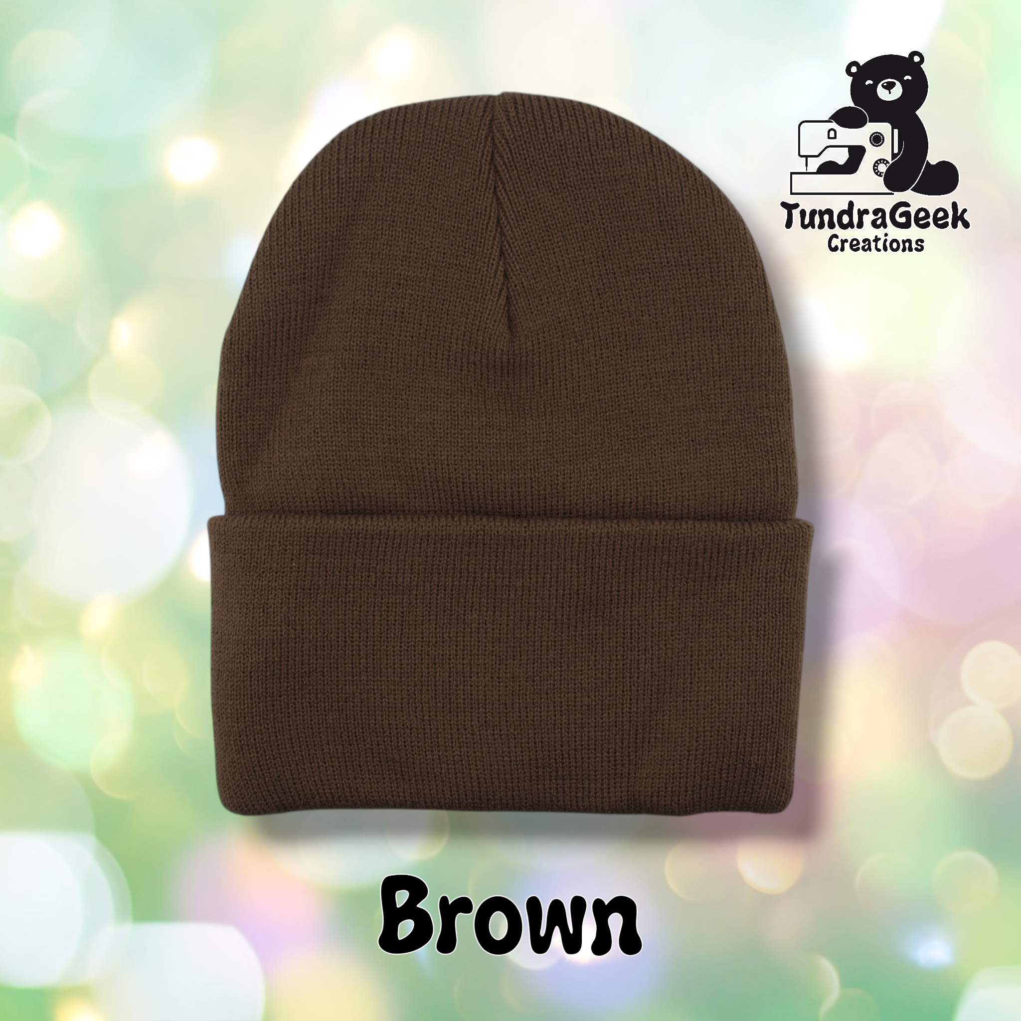 Plain brown cuffed beanie on a pastel bokeh background. Text reads "Brown" at the bottom of the image.
