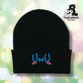 lack cuffed acrylic beanie with "UwU" embroidered in blue on the cuff. Pink blush marks are embroidered beneath the text. TundraGeek Creations logo in upper right corner.