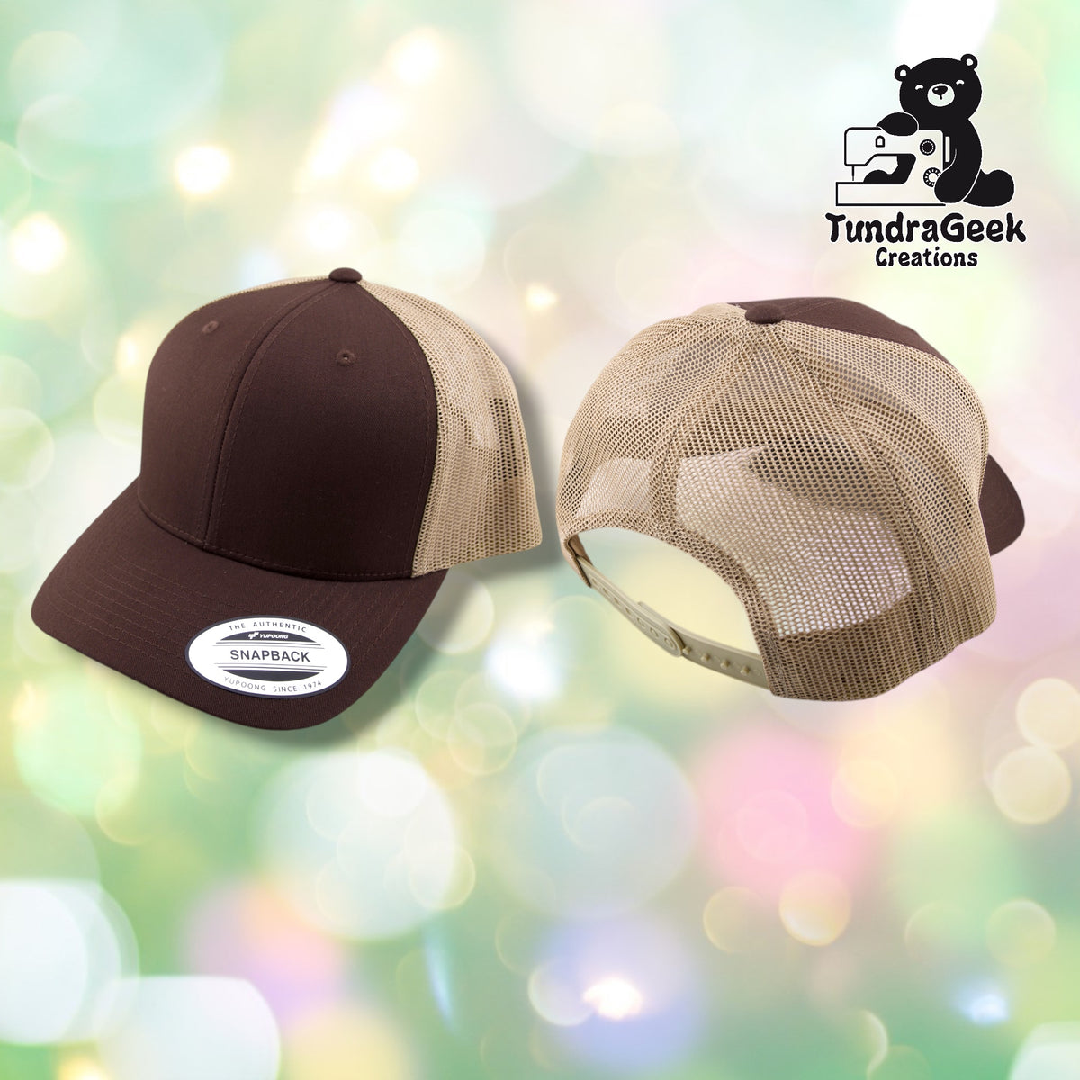 Two brown and beige trucker caps shown on a pastel bokeh background, with the TundraGeek Creations logo in the top right corner.