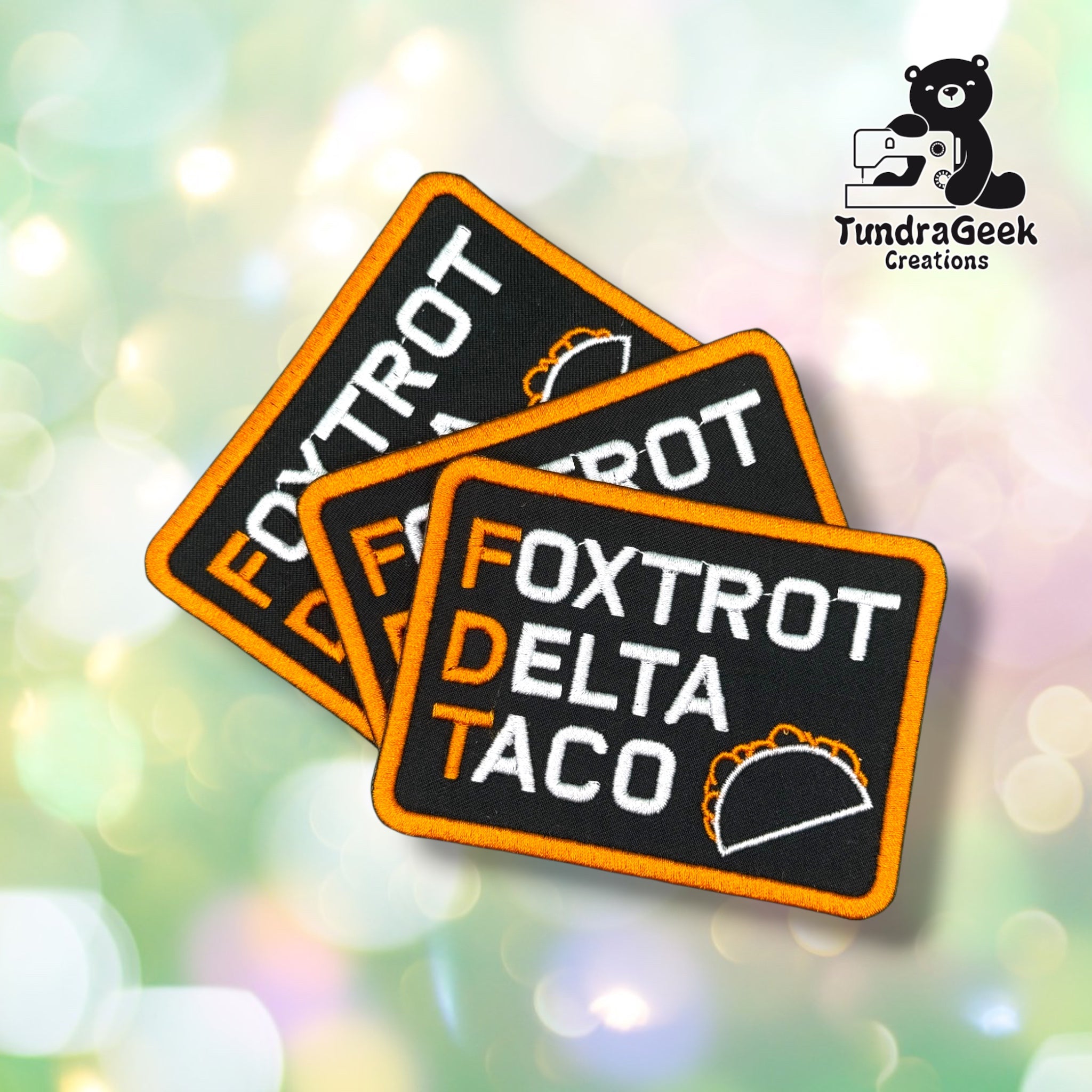 Three FDTaco patches fanned out together, each showing the same "FOXTROT DELTA TACO" lettering and taco outline design.