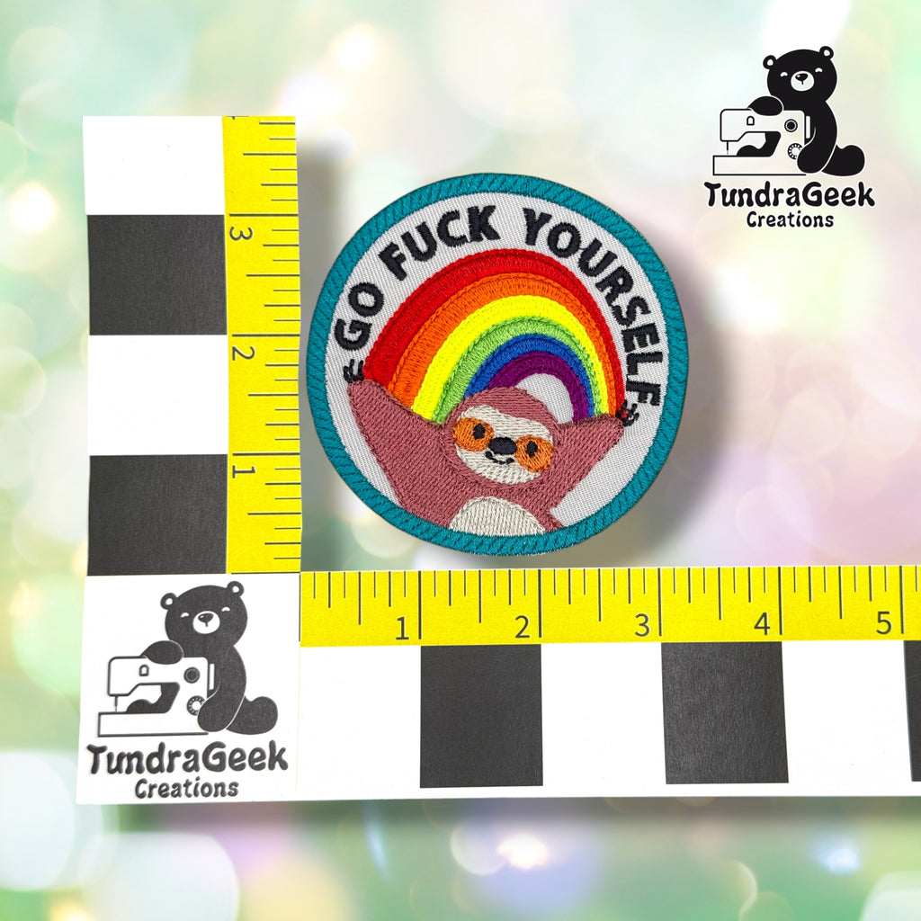 Patch measured against a yellow tailor's tape, confirming approximately 3.5 inches in diameter.  ---