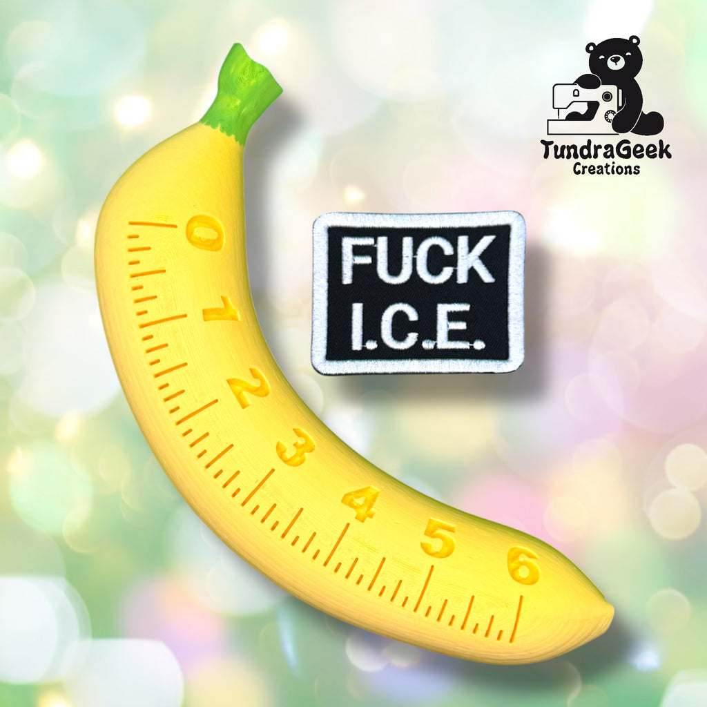 A banana-shaped measuring tape and a patch with the text FUCK I.C.E. are displayed on a blurred background, with a TundraGeek Creations logo in the top right corner.