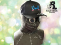 A mannequin head wearing a black hat embroidered with UWU and pink marks, with the TundraGeek Creations logo in the background.