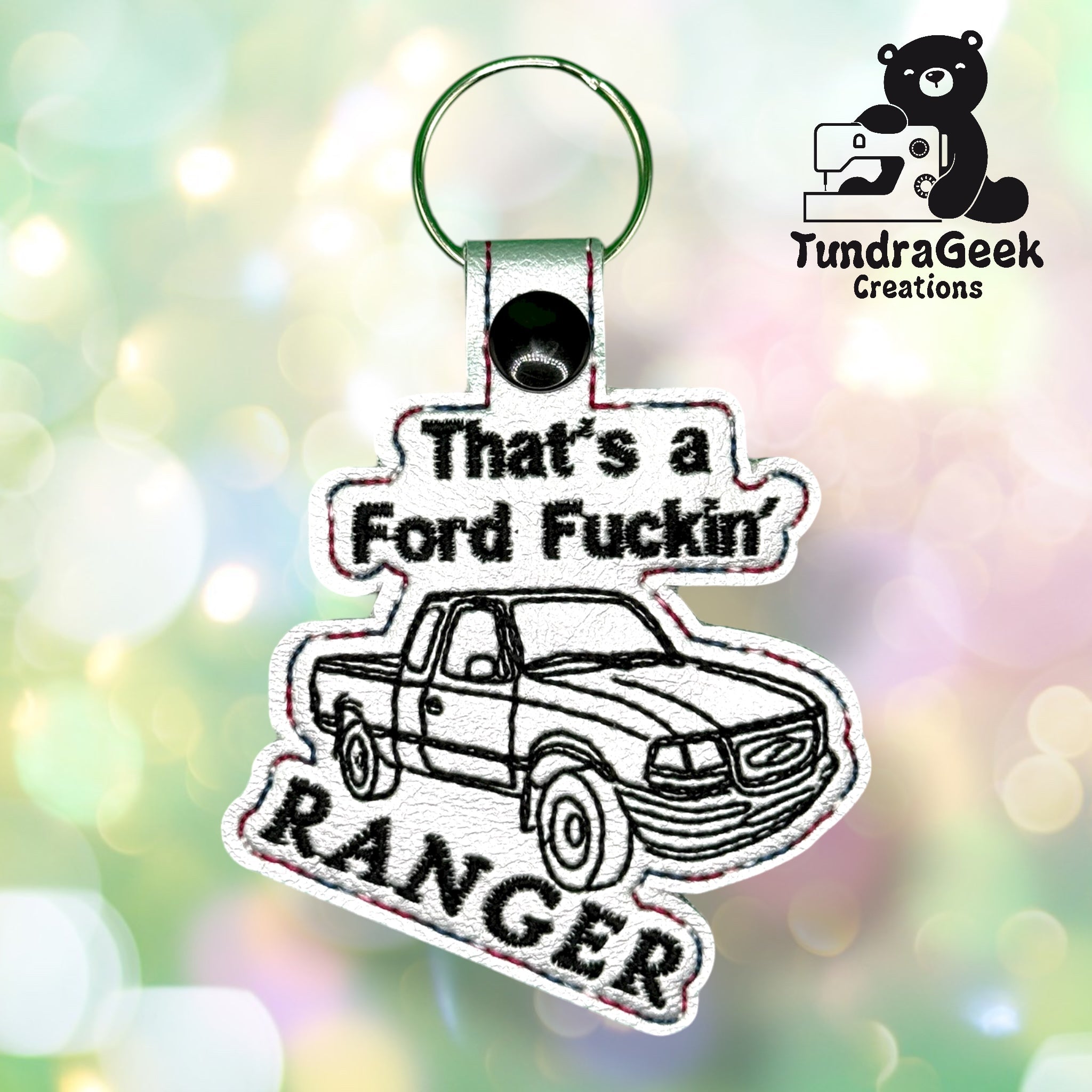 Embroidered keychain featuring a sketch of a pickup truck and the text “That’s a Ford Fuckin’ Ranger” with the TundraGeek Creations logo in the corner.