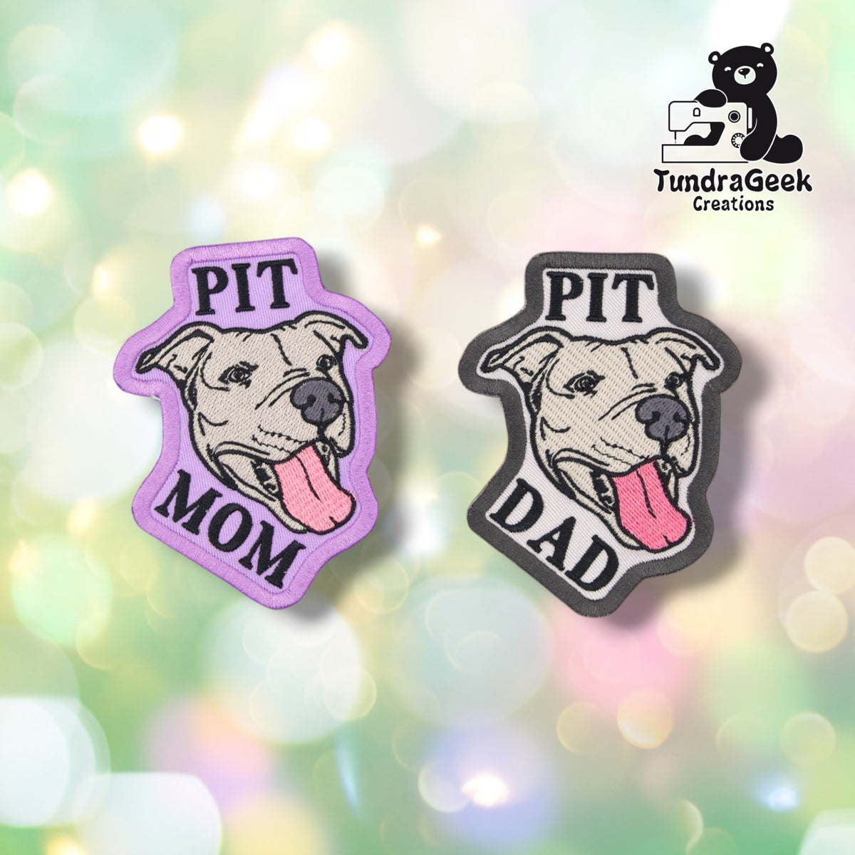 The Pit Mom patch in lavender with a purple merrowed edge and the Pit Dad patch in grey with a black merrowed edge, shown side by side. Both carry the identical smiling pitbull portrait, with "PIT" above and "MOM" or "DAD" below in matching block lettering.
