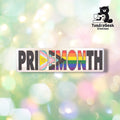 Horizontal die-cut holographic sticker reading "PRIDEMONTH" in bold block lettering on a silver holographic background. The letters D, E, M, O, and N are filled with Intersex Progress Pride flag colors; remaining letters display classic rainbow stripes. TundraGeek Creations logo in upper right corner.