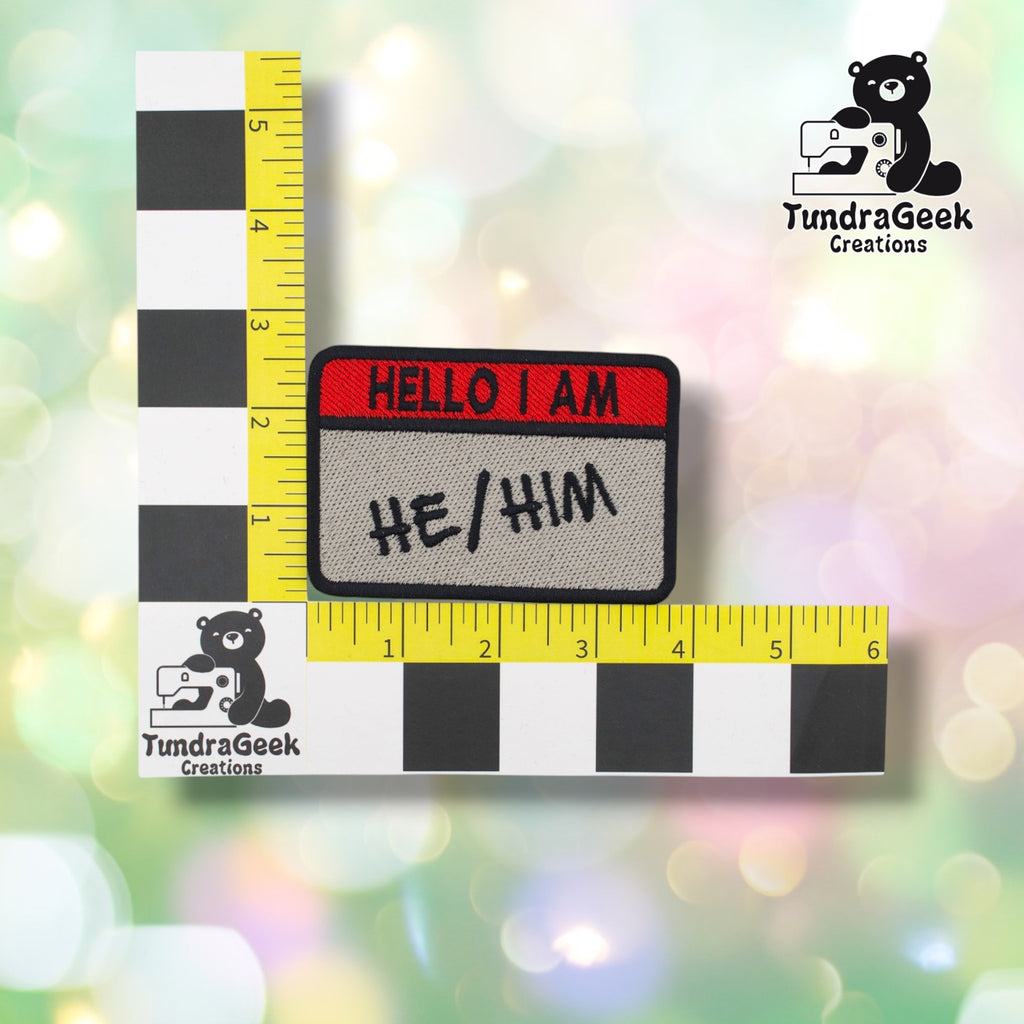 Patch measured against a tailor's ruler, confirming approximately 3.75in wide by 2.75in tall.