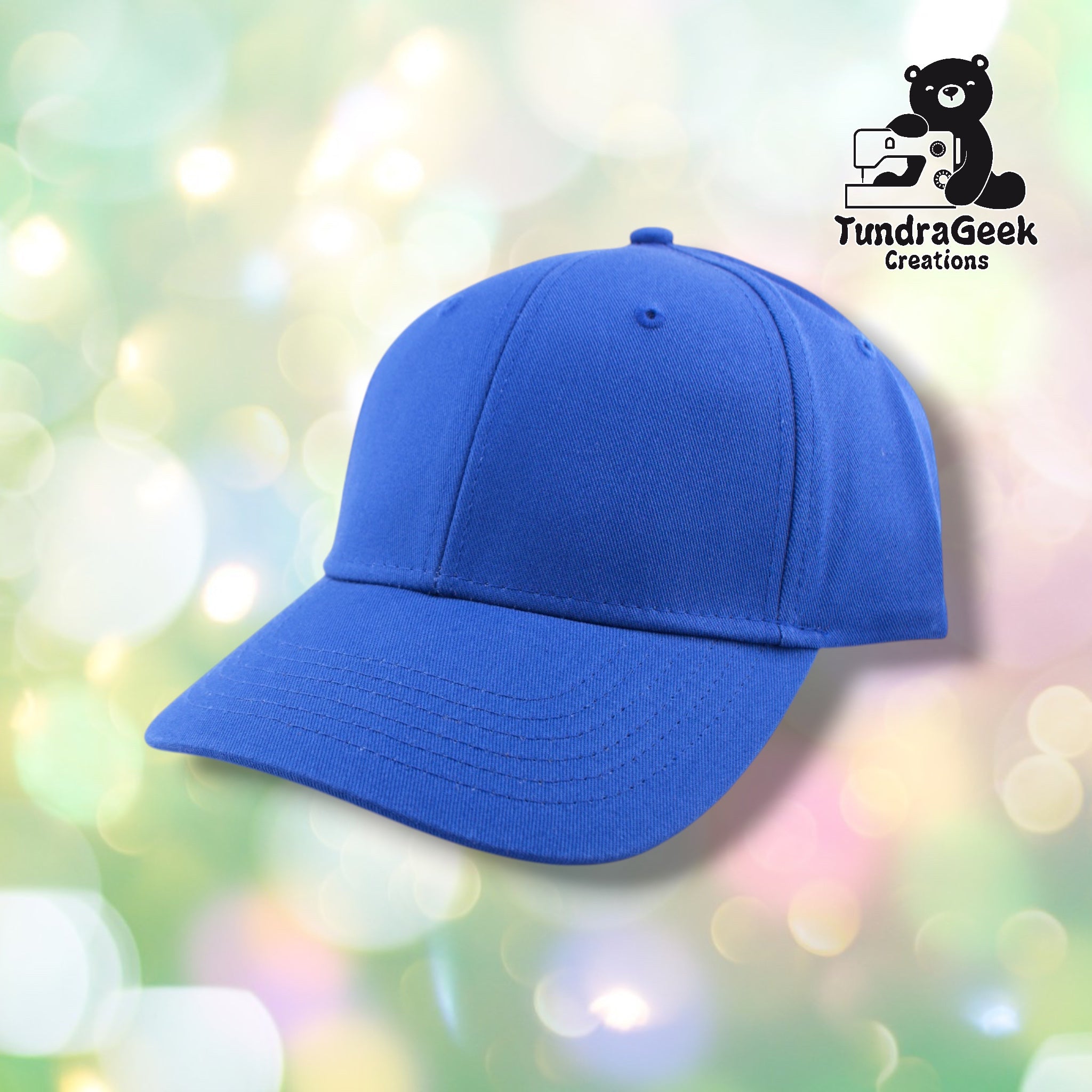 A bright blue baseball cap with ribbed fabric and curved bill displayed against a soft, blurred pastel background with bokeh lighting.