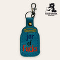 A blue embroidered keychain shaped like a jar with the words jar of fucks in colorful letters, and a metal clasp attached at the top. TundraGeek Creations logo is in the corner.