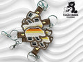 Three bear-shaped keychains with brown, yellow, orange, white, and black stripes on a wavy white background. Logo for TundraGeek Creations appears in the top right corner.