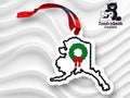 Embroidered ornament shaped like Alaska with a green wreath and red ribbon, displayed on a wavy white background with a TundraGeek Creations logo.