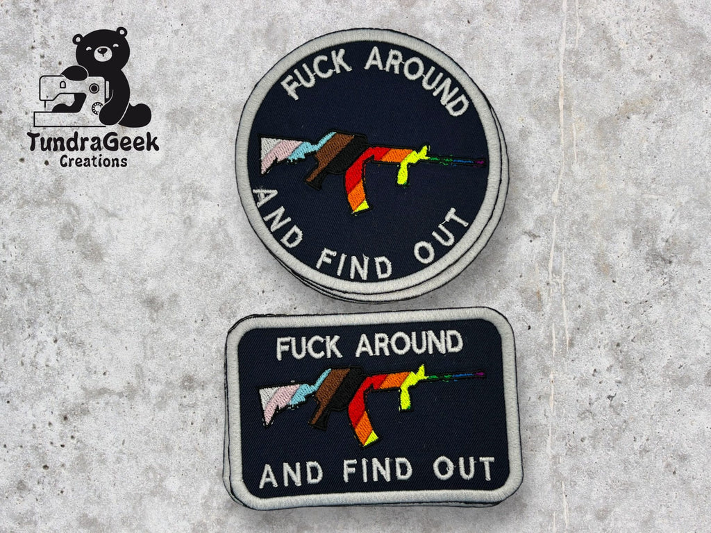 Two embroidered patches with a graphic of a rifle and the text FUCK AROUND AND FIND OUT. Logo for TundraGeek Creations with a bear and sewing machine is on the left.