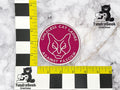 A pink circular patch reads CHILDLESS CAT LADIES AGAINST FASCISM around a minimalist cat face; rulers show a diameter of about 3 inches. TundraGeek Creations logos are in the corners.