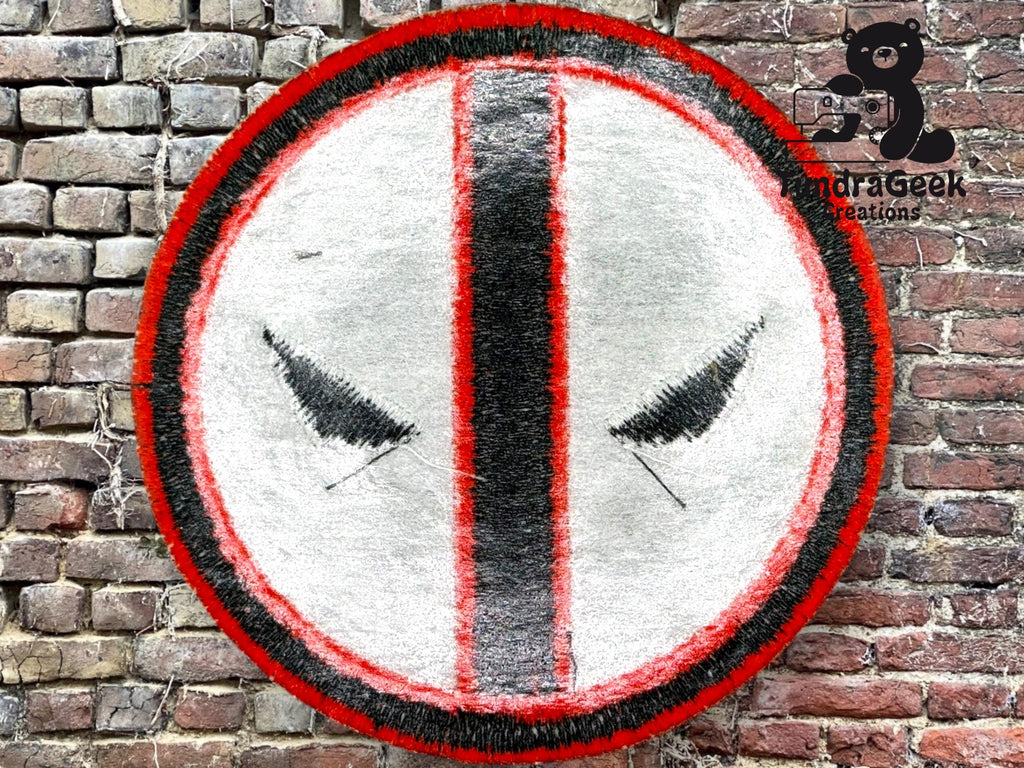 A circular white patch with a red and black border, black vertical stripe, and stylized black eye shapes, displayed on a brick wall background.