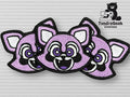 Three purple raccoon face embroidered patches overlap on a gray textured surface. The TundraGeek Creations logo with a bear and text appears in the top right corner.