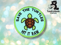 A round patch with a turtle illustration and the words SAVE THE TURTLES HIT IT RAW embroidered on it, with the TundraGeek Creations logo in the corner.