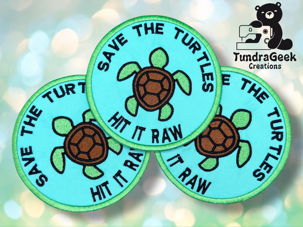 Three round turquoise patches display a turtle illustration and the text SAVE THE TURTLES HIT IT RAW; TundraGeek Creations logo with a bear sewing is in the top right corner.