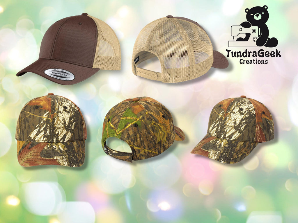 Five baseball caps in brown and camouflage patterns are displayed on a blurred pastel background with a TundraGeek Creations logo in the top right corner.