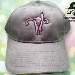Gray baseball cap with a uterus flipping you off embroidered on it